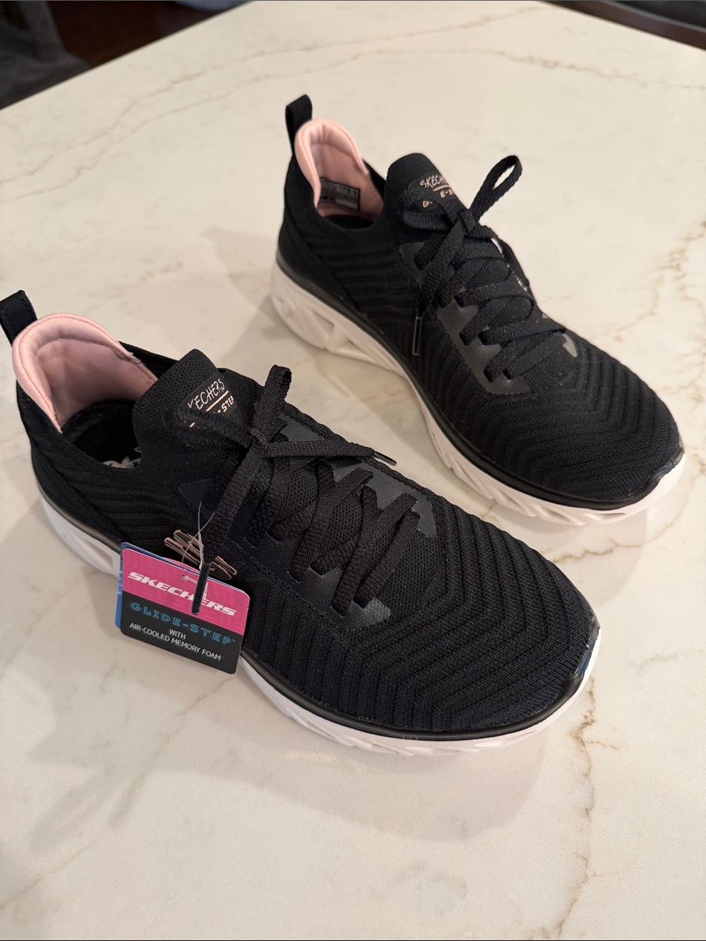 Skechers Women’s Black Knit Glide Step Sneakers with Pink Lining